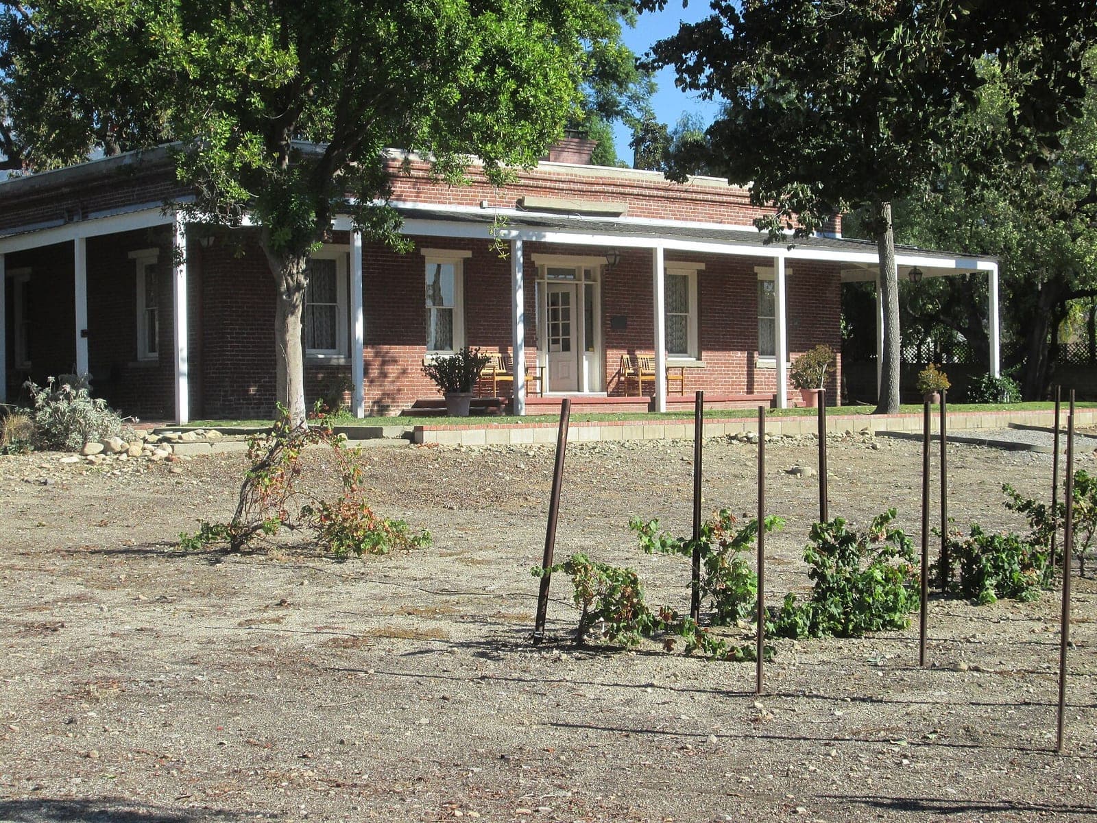 The 1860 fired-brick John Rains House behind its garden in Rancho Cucamonga
