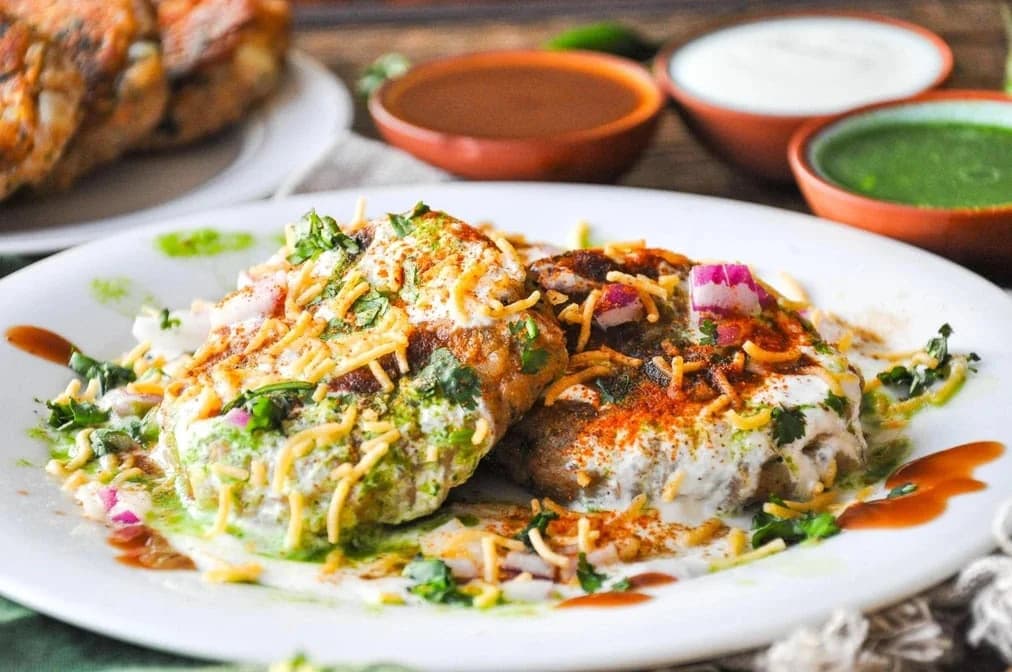 Chaat topped with yogurt, chutneys, sev, onion and cilantro from Kohinoor Bites Pizza & More
