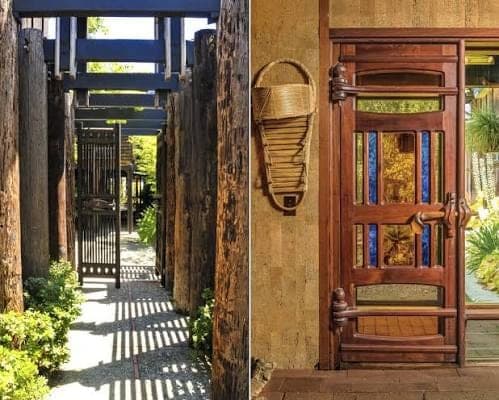 A timber-posted walkway at the Maloof compound beside the carved front door, with stained glass panels and a woven basket on the wall