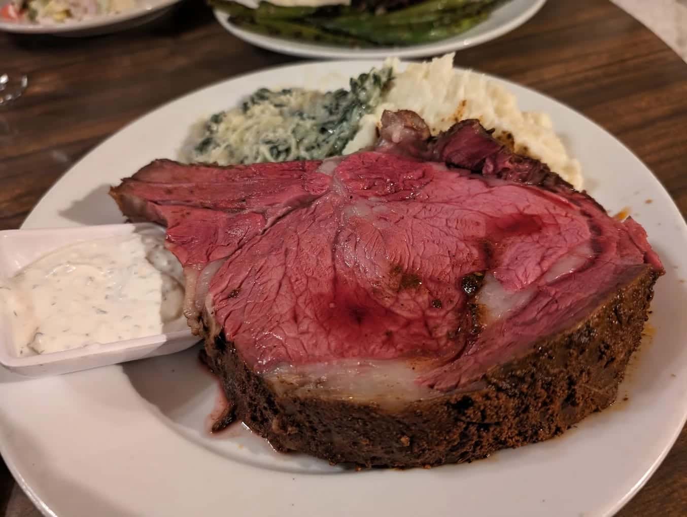Bone-in prime rib with mashed potatoes and creamed spinach at The Sycamore Inn