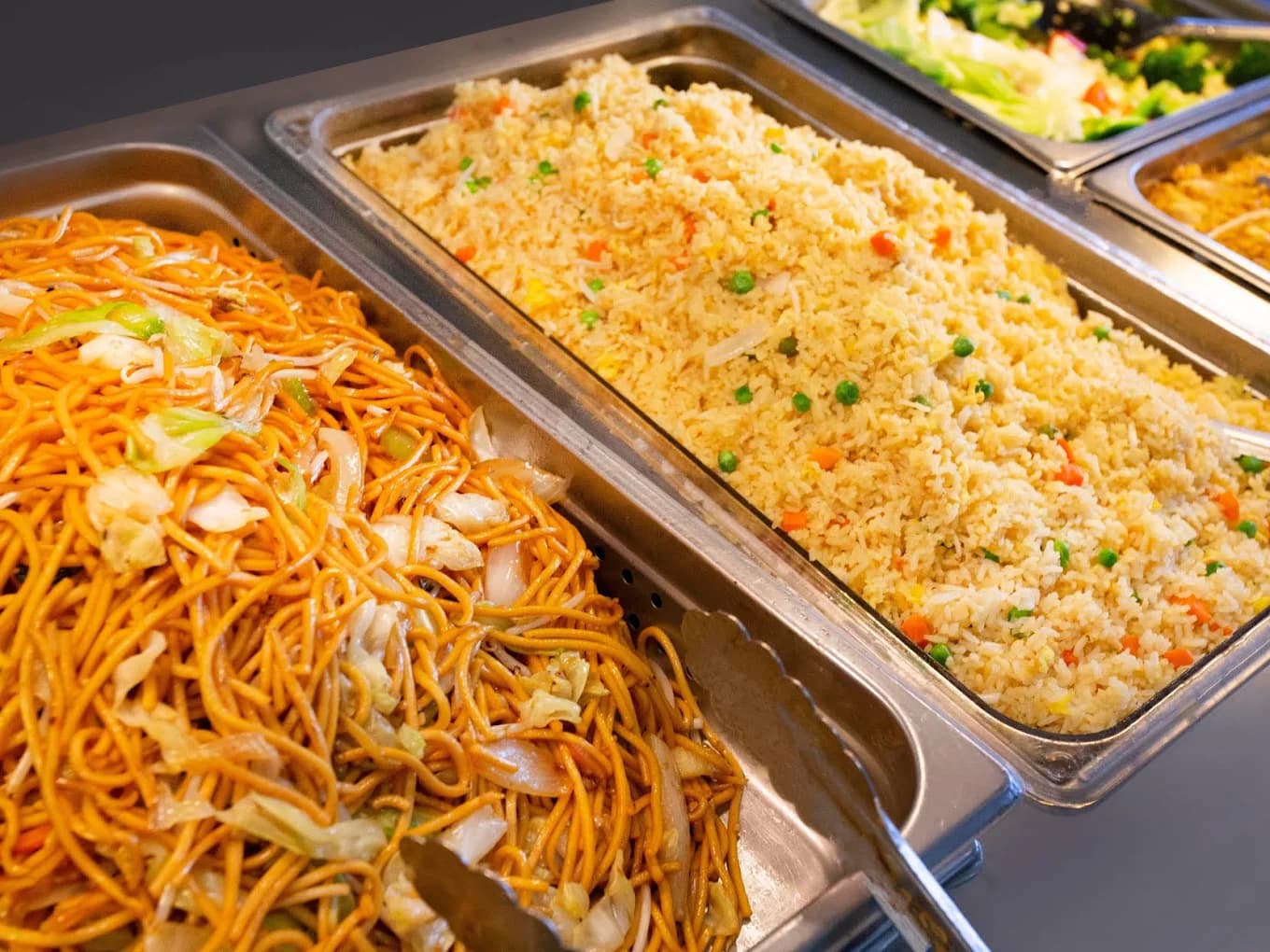 Steam-table trays of chow mein and vegetable fried rice at Tasty Goody Chinese Fast Food